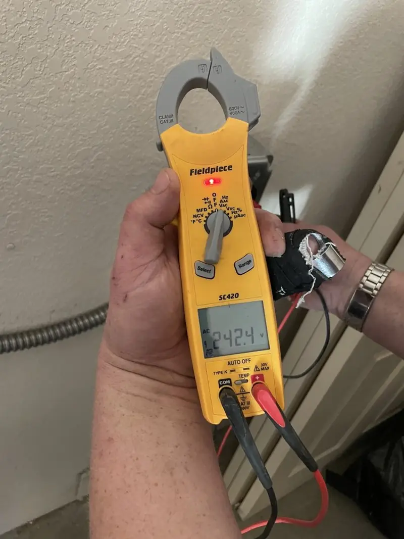 Voltage testing with clamp meter during Outlet Installation in Covington